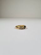 18K yellow gold dress ring with central oval faceted green tourmaline each shoulder set 3 graduating