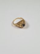 Unusual 18ct gold dress ring with bark effect dome, with central round cut sapphire surrounded 8 bri