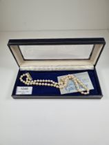 Single row of pearls with 18ct yellow gold clasp, 45cm unmarked but possibly Mikimoto, in Mikimoto b