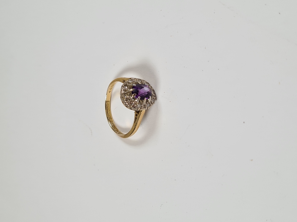 18ct and Platinum Cluster ring, with central oval mixed cut amethyst, surrounded small diamond chips - Image 6 of 6