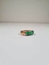 14K yellow gold ring with oval Jade panel, on floral engraved shoulders, size P, marked 585, approx