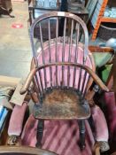 An antique stickback child's chair with turned legs