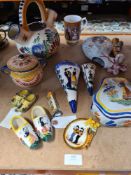 A quantity of French Quimper items to include an early 20th Century wall pocket