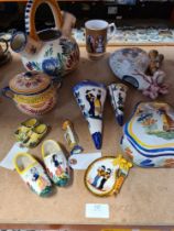 A quantity of French Quimper items to include an early 20th Century wall pocket