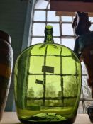 A Green glass carboy and a Western Germany vase