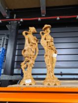 Two oriental figures in resin, colourised to mimic Ivory