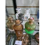 Two similar 19th century scent bottles, having overlaid pierced brass decoration and 4 others