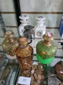Two similar 19th century scent bottles, having overlaid pierced brass decoration and 4 others