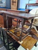 An antique oak table having turned legs with stretcher, a single chair and miniature stool