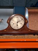 A selection of mantle clocks of various materials, including wood, ceramic and brass carriage clock