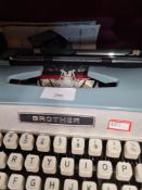 A vintage Brother typewriter and a box of various Bristol glasses
