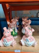 Two sets of 5 Nat West pig money boxes