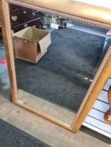 A modern gilt framed wall mirror and a decorative walnut mirror