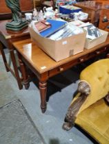 A Victorian mahogany side table having 2 drawers with replacement top