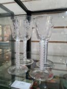 Two similar 19th Century, air twist glasses having floral engraved decoration and two others