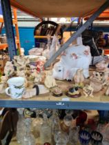 A large selection of Piggins figures and a china money box in the form of a piggy