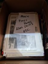 A small box of movie press packs, film stills, etc