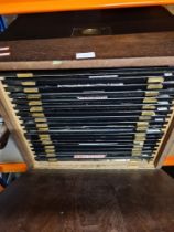 A wooden collector's cabinet mostly suited to the display of medals and badges, etc