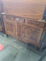 An antique French buffet having 3 drawers with cupboard below, probably Walnut, 133cm