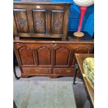 An early 18th Century oak mule chest having panelled front with 2 drawers below, 143.5cm