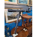 A Bushnell model 565 refractor telescope on adjustable tripod