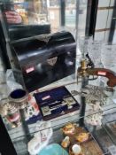 A mixed lot to include a Victorian dome topped tea caddy, a pistol shaped lighter, silver hinges and