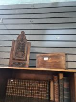 An old candle box having carved front decorated flowers and vase and a Victorian Rosewood tea caddy