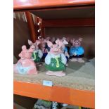 Two sets of 4 Nat West pig money banks and 3 others