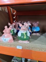 Two sets of 4 Nat West pig money banks and 3 others