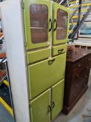A 1950s Kitchen cabinet having full front with enamelled surface, 178cm
