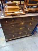 A chest of drawers, 2 over 3, with brass drop handles