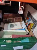 A box of ephemera including art work, prints, a book