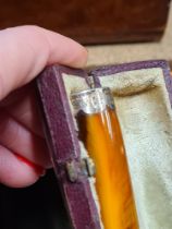 A wooden writing slope and a wooden box containing lighters and a Morris 8 car badge