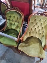 Two similar Victorian button back nursing chairs on cabriole legs