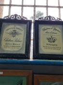 A pair of painted metal picture frames