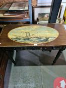 An antique side table on turned legs, the top having oval painting of 19th Century steamer ship "New