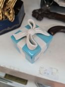 A Tiffany & Co porcelain box having bow decorated lid