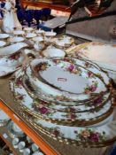 A selection of Royal Albert Country Roses, including tea pot, coffee pot, lidded tureen, plates and