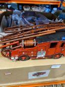 A selection of collector's plates depicting trains, barges, etc and a modern metal model of a Fire E