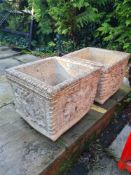 A pair of reconstituted stone square planters