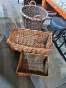 An old wicker log basket and two other oblong baskets