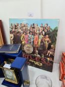 An original Beatles vinyl LP (Sgt Peppers Lonely Heats Band 1967) having black centre with yellow wr