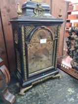 An antique twin fusee bracket clock with ebonised case, gilt metal mounts and engraved back plate (A