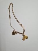 9ct yellow gold figaro design bracelet, with heart shaped clasp and hung with Australian charm, mark