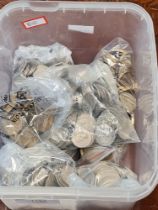 A tub of GB coins to include Shillings, sixpence and 3 pence (some half silver examples)