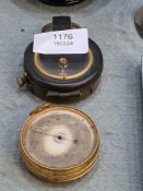A Military Pocket compass stamped 1917, and a compensated pocket barometer