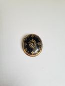 Antique yellow metal oval mourning brooch with black enamel front and 3 seed pearls, the front openi