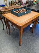 An antique French Walnut desk having central drawer on cabriole legs, 84cm