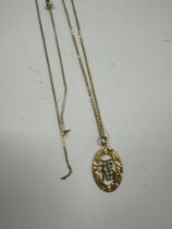 9ct yellow gold fine neckchain hung with a 9ct oval pendant depicting character marks and another 9c