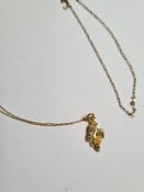 Fine 9ct yellow gold neckchain, a fine 10K gold neckchain hung with a pendant in the form of leaves,